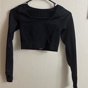 Black, ribbed, long sleeve crop top.